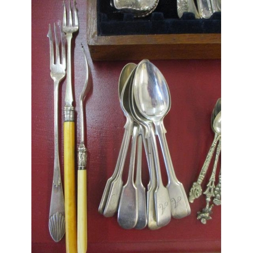 67 - A large quantity of miscellaneous silver plated cutlery and flatware, to include a silver napkin rin... 