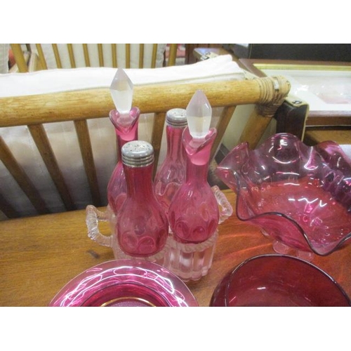 238 - A collection of early to mid 20th century cranberry glassware to include an oil lamp