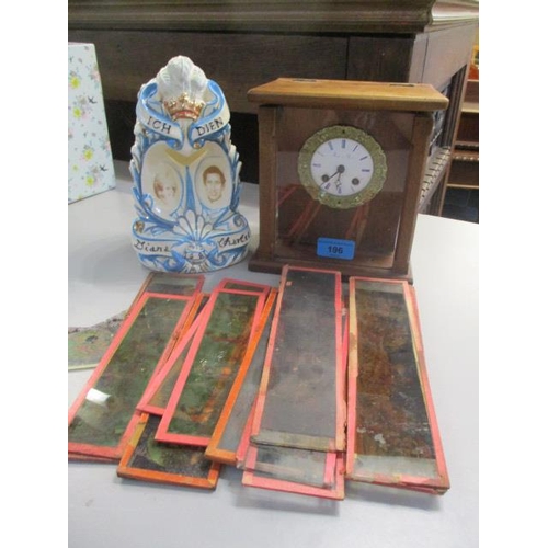 196 - A mixed lot to include a Derek Fowler commemorative piece of china, a French clock and mixed slides