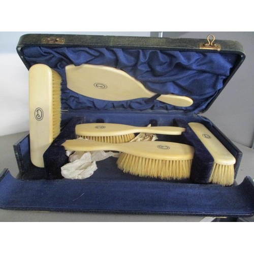 197 - A late 19th/early 20th century boxed ivory dressing table set