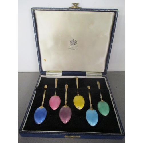 198 - A cased set of early 20th century silver gilt and enamelled spoons