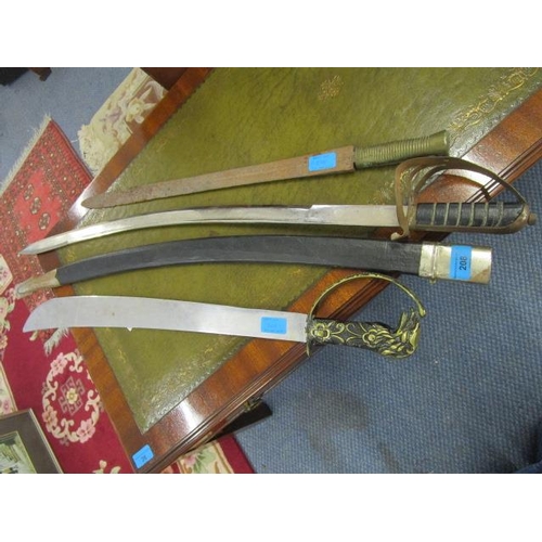 208 - An Indian curved sword with engraved blade, blade 30