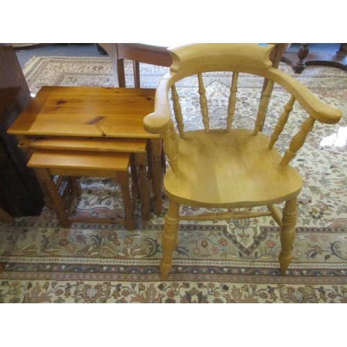 224 - A nest of pine tables, together with a pine Captain's style chair