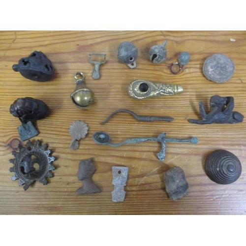 262 - Antique, Roman and other metal detectorists finds to include rams bells, A Roman copper alloy spatul... 