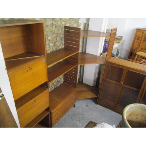 282 - A mid 20th century Ladderax unit consisting of a display cabinet, a chest of drawers, cabinets and s... 