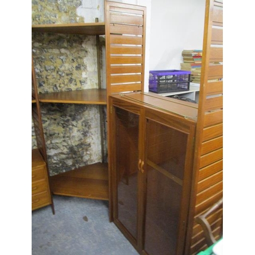 282 - A mid 20th century Ladderax unit consisting of a display cabinet, a chest of drawers, cabinets and s... 