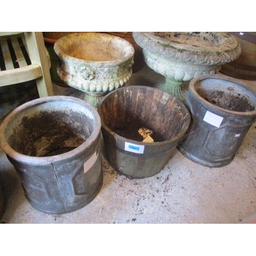 302 - Two teak garden planters and a pair of fibreglass planters