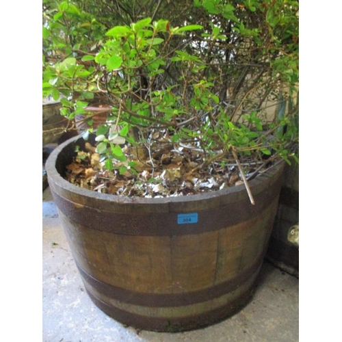 304 - A teak and metal support large garden planter 15 1/2