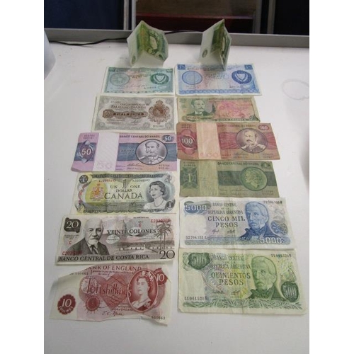 332 - A group of British and foreign banknotes to include a J S Forde ten-shilling note, a Falkland Island... 