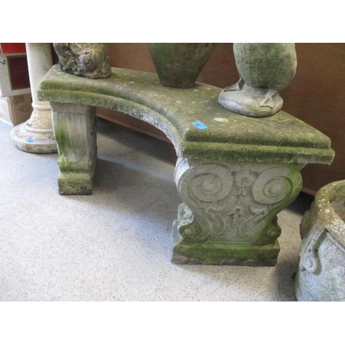 357 - A weathered composition stone curved garden bench 40