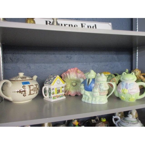 370 - A collection of novelty teapots together with a Royal Stafford 2002 commemorative teapot