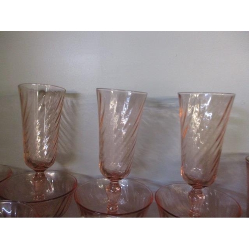 378 - A quantity of pink drinking glasses to include twelve wine, twelve champagne flutes, sixteen champag... 