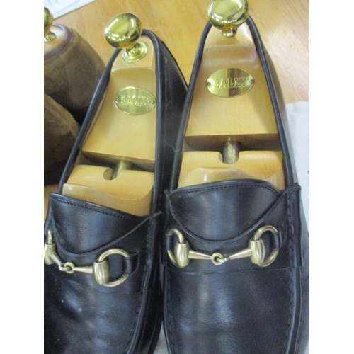 404 - Three pairs of Gucci gents loafers size 43 1/2E, together with one Gucci dust bag, and two Bally woo... 