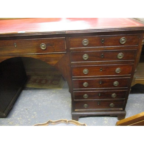 408 - An early 19th century mahogany twin pedestal desk with a central drawer flanked by six drawers and a... 