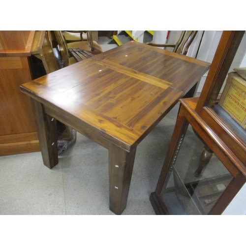 493 - A modern hardwood extending dining table on block shaped legs, 31