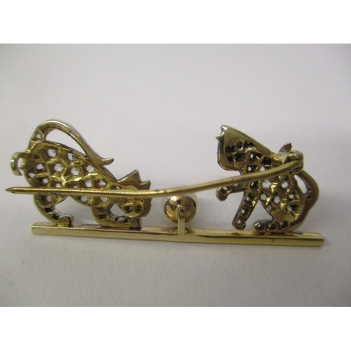 37 - A gold and white coloured metal brooch fashioned as two kittens playing with a pearl, set with sapph... 