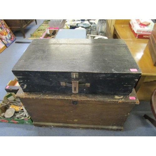 180 - A Victorian stained pine trunk with iron carrying handles and a black painted wooden chest