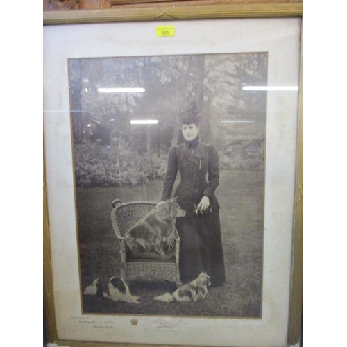 225 - An early 20th century framed photograph of Queen Alexandra and her dogs, signed, circa 1910