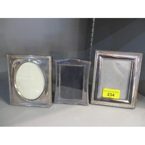 234 - Three small silver photo frames