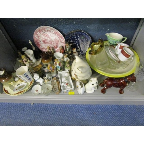 246 - Three shelves of miscellaneous china, ornaments and glassware to include two claret jugs, part tea s... 