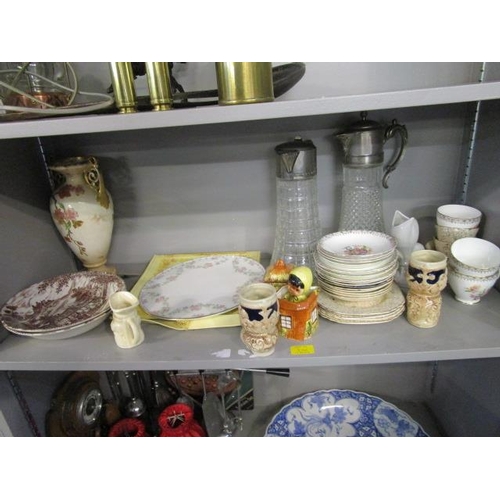 246 - Three shelves of miscellaneous china, ornaments and glassware to include two claret jugs, part tea s... 