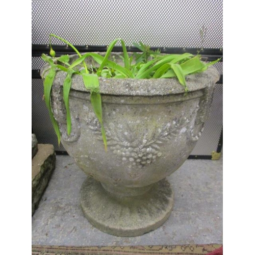 379 - A pair of stoneware garden planters decorated with olive vines on circular bases