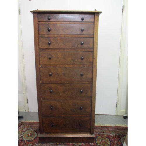 264 - A Victorian mahogany Wellington chest of eight graduated drawers with a galleried top, on a plinth, ... 