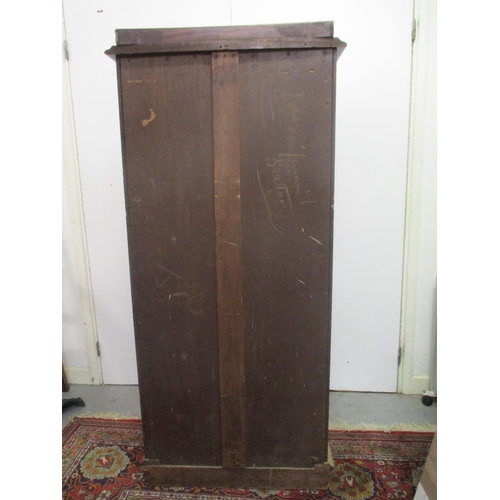 264 - A Victorian mahogany Wellington chest of eight graduated drawers with a galleried top, on a plinth, ... 