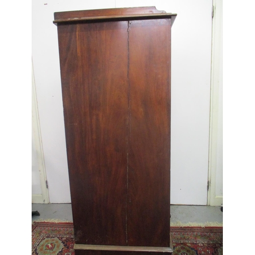 264 - A Victorian mahogany Wellington chest of eight graduated drawers with a galleried top, on a plinth, ... 