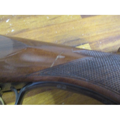 299 - A BC Miroku 12-bore double barrel under and over shotgun with fixed chokes, 28