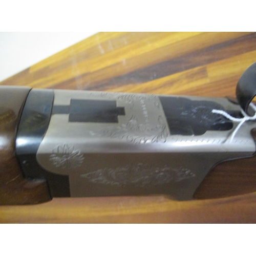 299 - A BC Miroku 12-bore double barrel under and over shotgun with fixed chokes, 28