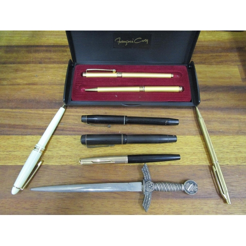 71 - A quantity of fountain pens to include a Parker 61 and a paper knife in the form of a dagger