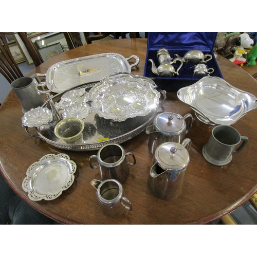 72 - A quantity of silver plate to include a galleried tray and a boxed four pieced teaset