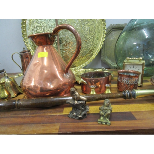 73 - Mixed copper and brassware to include a warming pan, along with a glass carboy