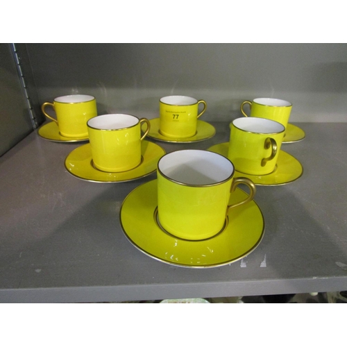 77 - A Lynton china set of six yellow ground coffee cups and saucers