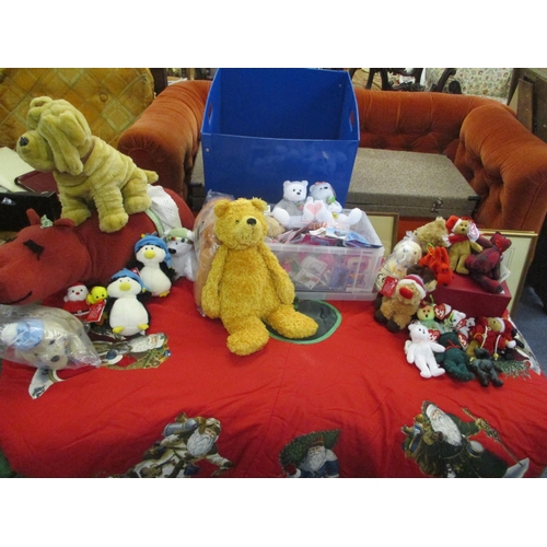 79 - A mixed lot of soft toys to include Andrex Puppies, Christmas Beanies, a red hippo and pin badges