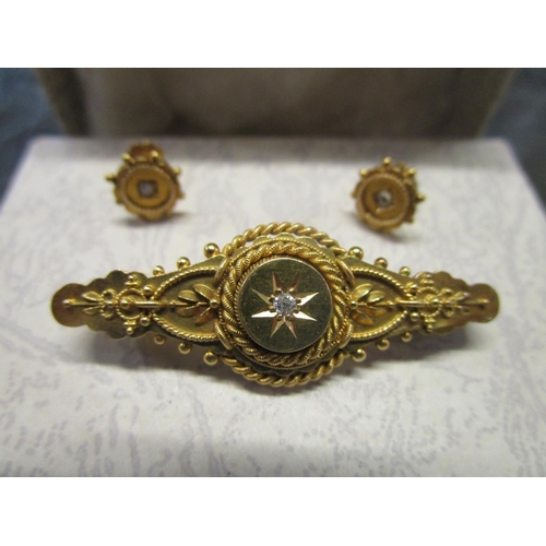 83 - A Victorian 15ct gold and diamond set bar brooch with matching ear studs