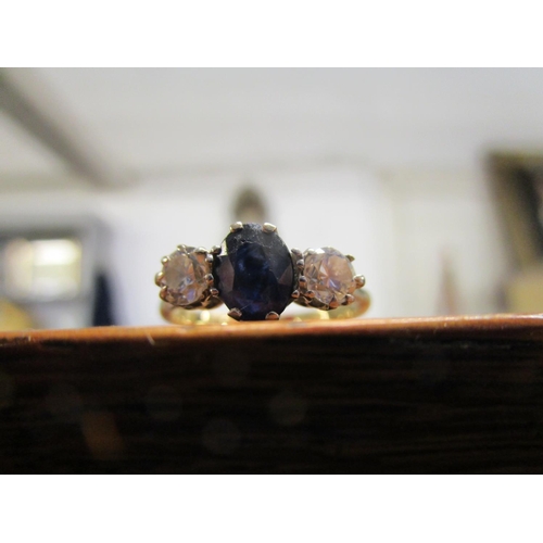 87 - An 18ct yellow gold sapphire and diamond three-stone ring, total weight 3.3g