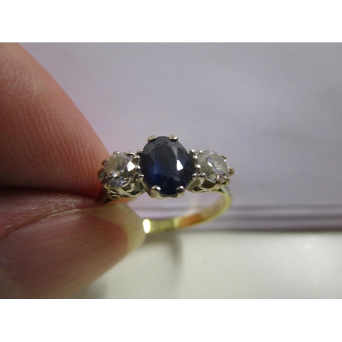 87 - An 18ct yellow gold sapphire and diamond three-stone ring, total weight 3.3g