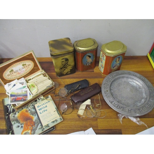 93 - Collectables to include spectacles, three commemorative tins, a pewter collection plate and cigarett... 