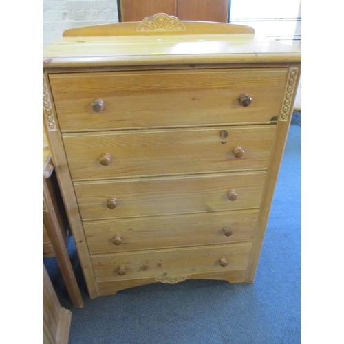 64 - An M & S pine chest of five long drawers