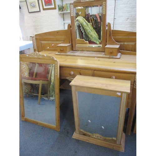 65 - A selection of M & S pine furniture to include a dressing table with mirror, a double headboard, a w... 