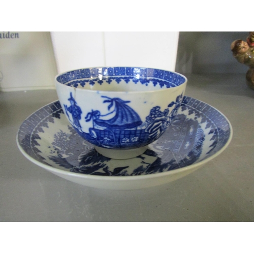 489 - A Worcester 18th century blue and white tea bowl and saucer, decorated in the Fisherman and Cormoran... 