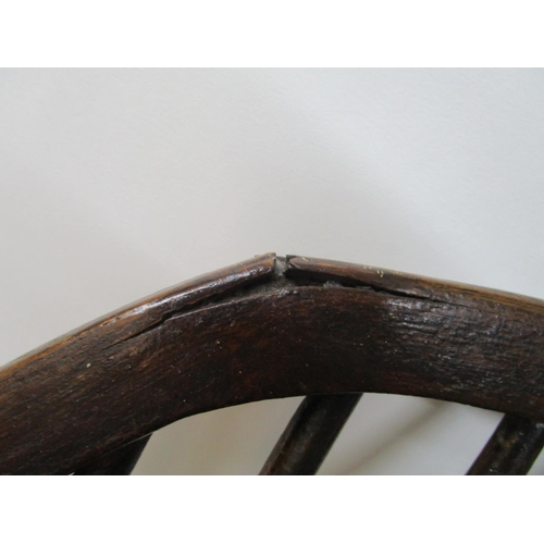 179 - A 19th century ash and elm Windsor chair with a pierced, splat, level arms and moulded seat, on ring... 