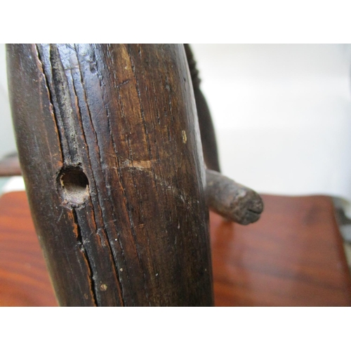 179 - A 19th century ash and elm Windsor chair with a pierced, splat, level arms and moulded seat, on ring... 