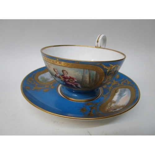 185 - A Sevres Chateaux de Dreux large cup and saucer, the cup decorated with a vignette of a boy and girl... 