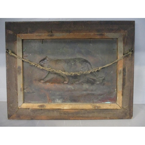 180 - An Arts & Crafts copper plaque decorated with a jaguar in a carved oak frame, 8