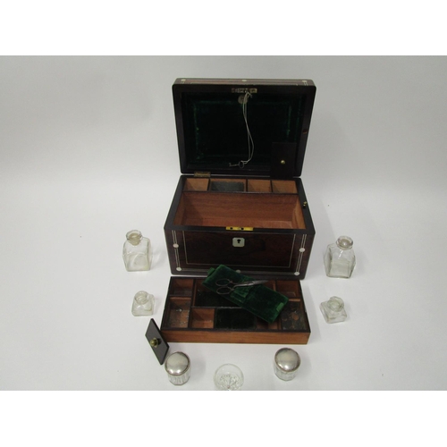 364 - A Victorian mother of pearl inlaid rosewood vanity case with a hinged lid, enclosing a green leather... 