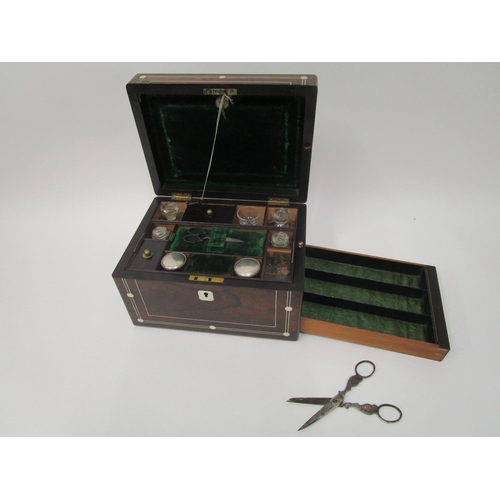 364 - A Victorian mother of pearl inlaid rosewood vanity case with a hinged lid, enclosing a green leather... 