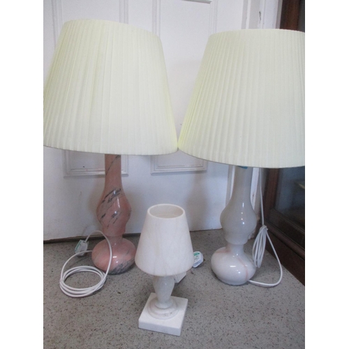 72 - A 1960s alabaster Spanish chalice formed lamp, together with two marble table lamps, PAT tested
Loca... 